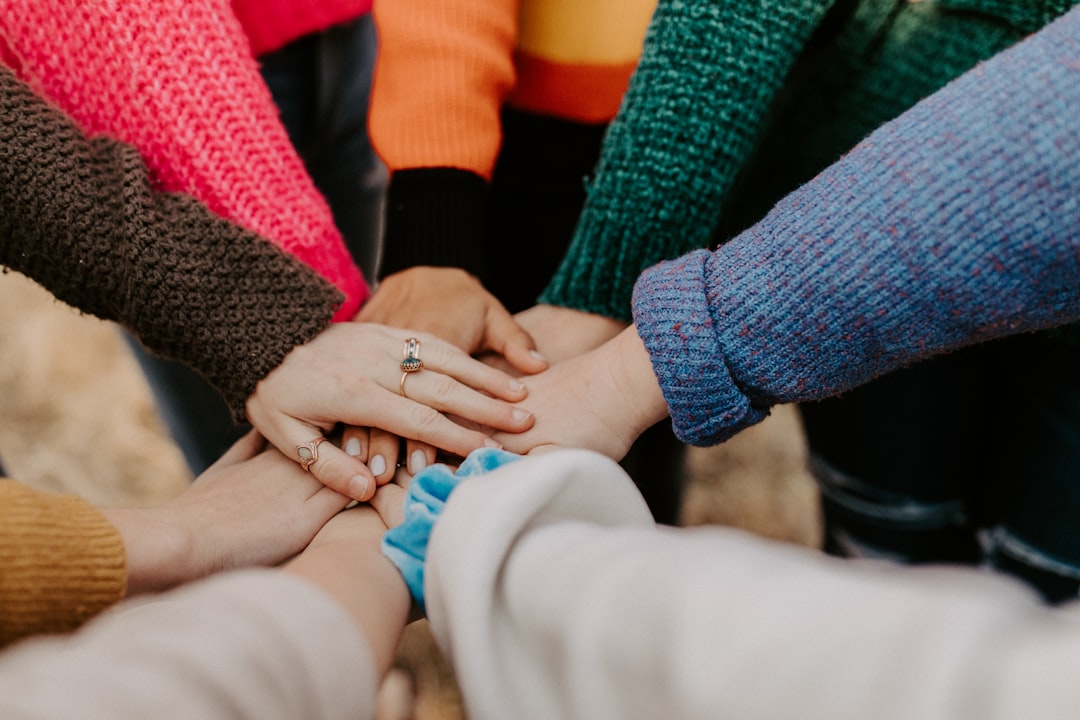 A diverse group of people engaging in a community activity, showcasing connection and support in a shared living environment.